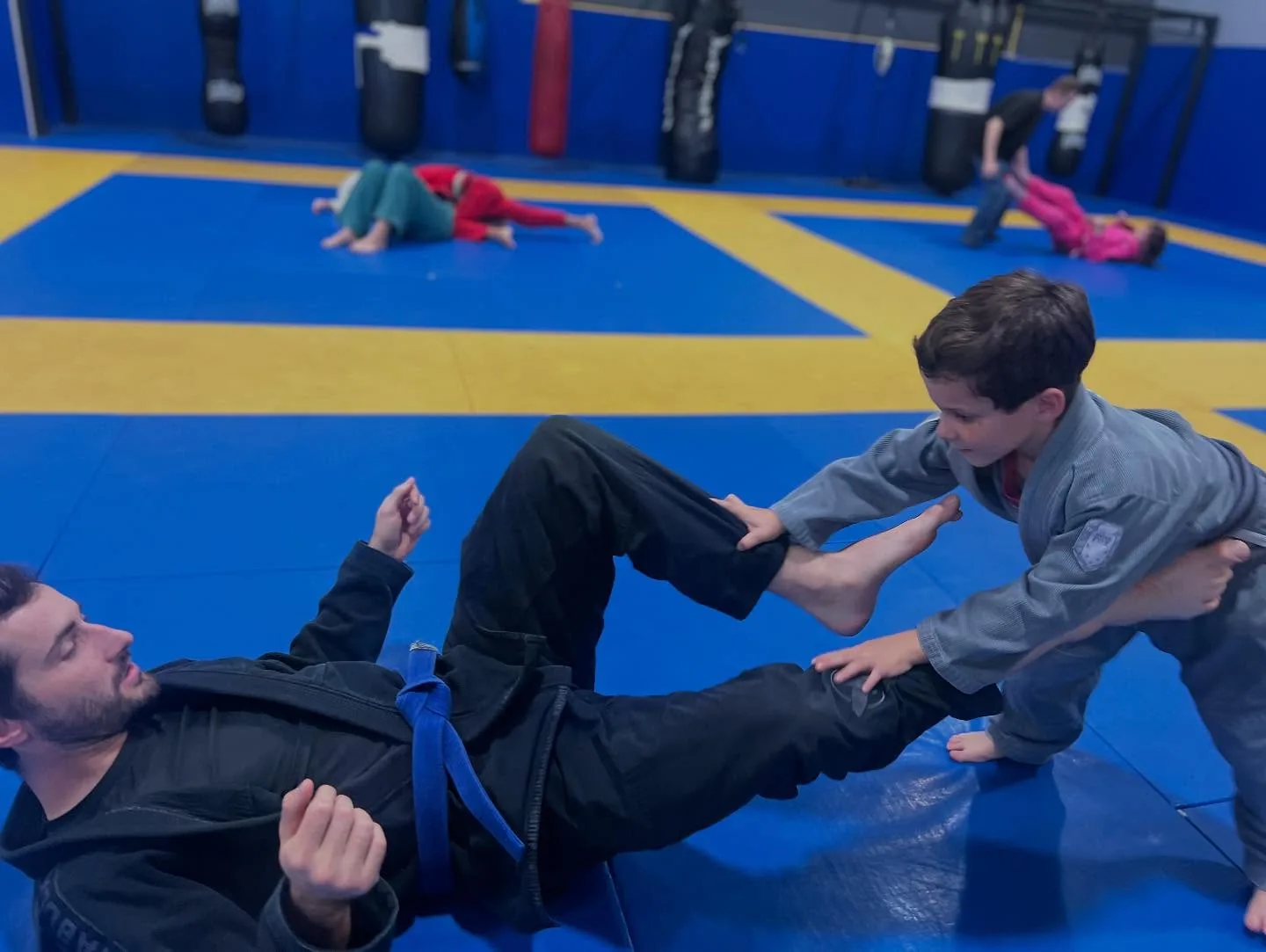 Dad and son BJJ class Zingano Broomfield