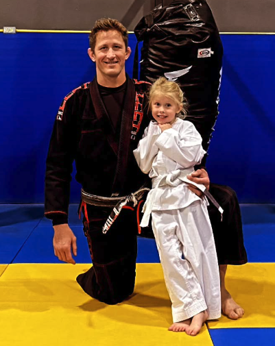 Father and daughter training BJJ together at Zingano Broomfield Colorado